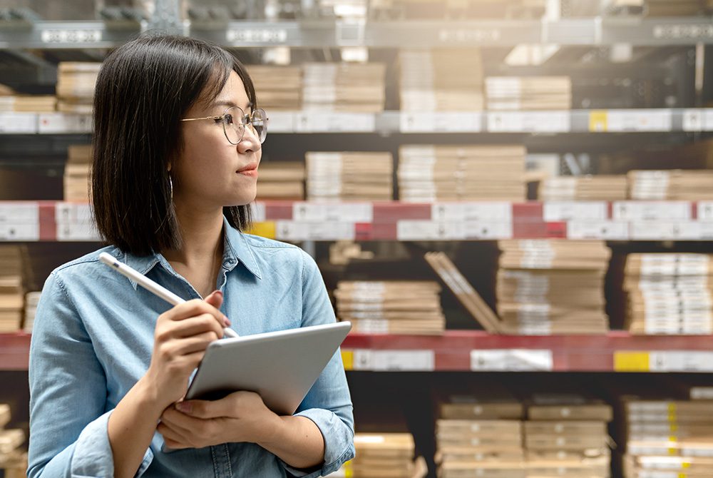 Woman taking inventory of stock